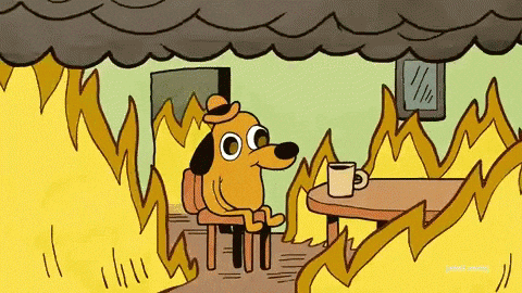 Cartoon dog calmly sipping coffee at a table while the room around him is on fire